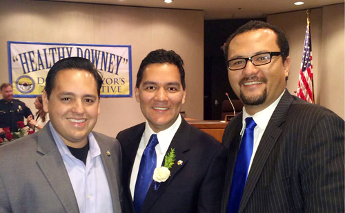  Fernando Vasquez, center, was sworn-in as Downey mayor Tuesday. He is pictured with finance commissioners Jason Valle and Ricardo Perez. 